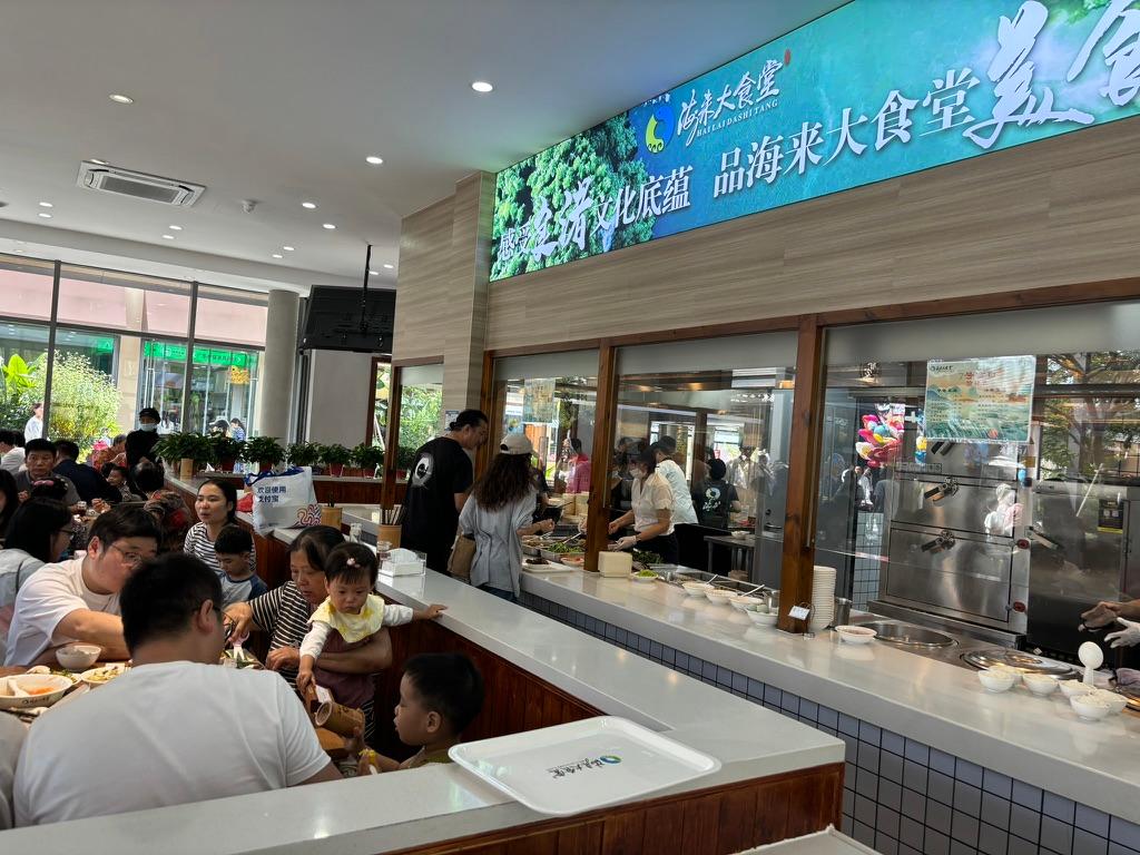 The cafeteria is crowded at noon, with no empty seats